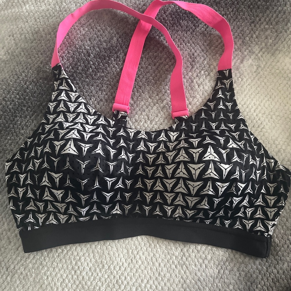Black and white sports bra with pink accents